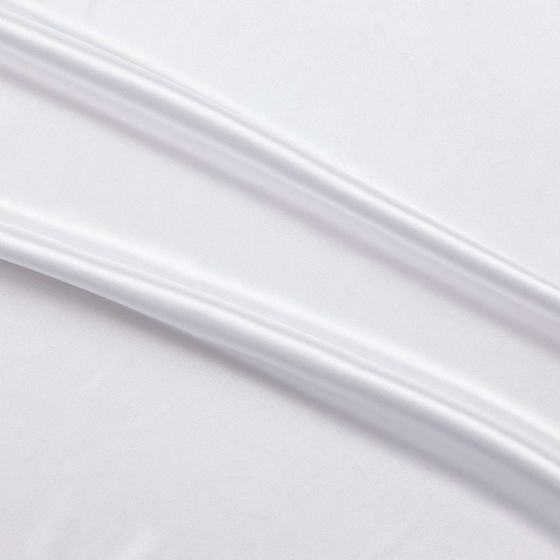 lola presenting the white color version of a stretch light weight soft satin polyester with spandex