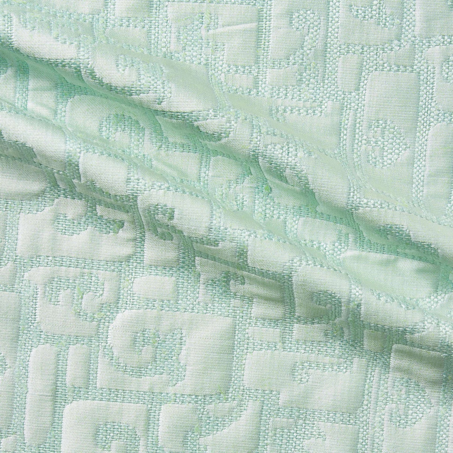luxor presenting the mint color version of a heavy weight pure silk brocade with abstract Egyptian styled pattern