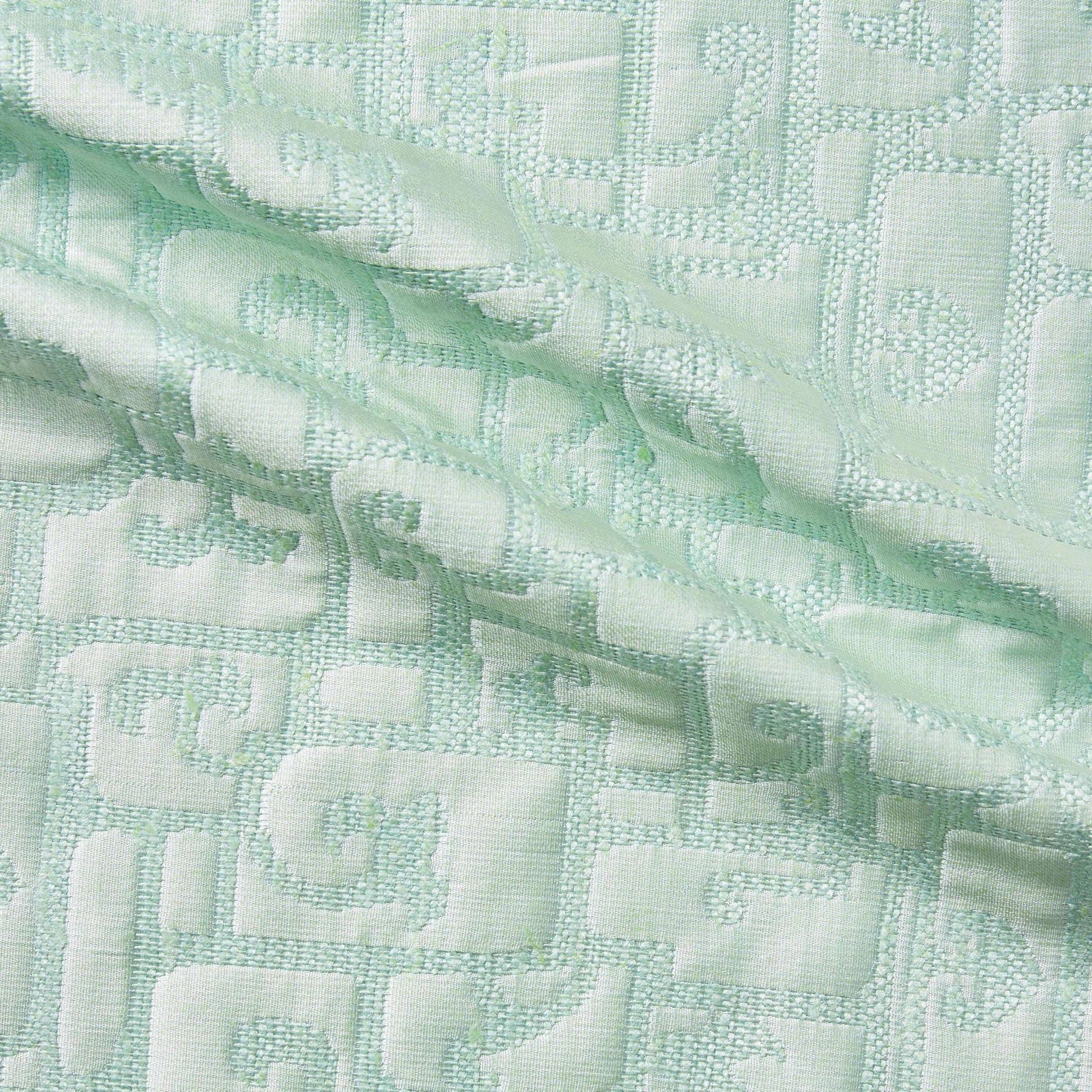 luxor presenting the mint color version of a heavy weight pure silk brocade with abstract Egyptian styled pattern