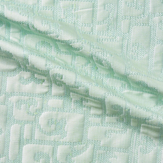 luxor presenting the mint color version of a heavy weight pure silk brocade with abstract Egyptian styled pattern