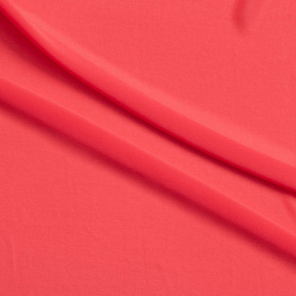 microgette presenting the coral color version of a sheer soft plain weave Polyester microfibre with matte face and good drape