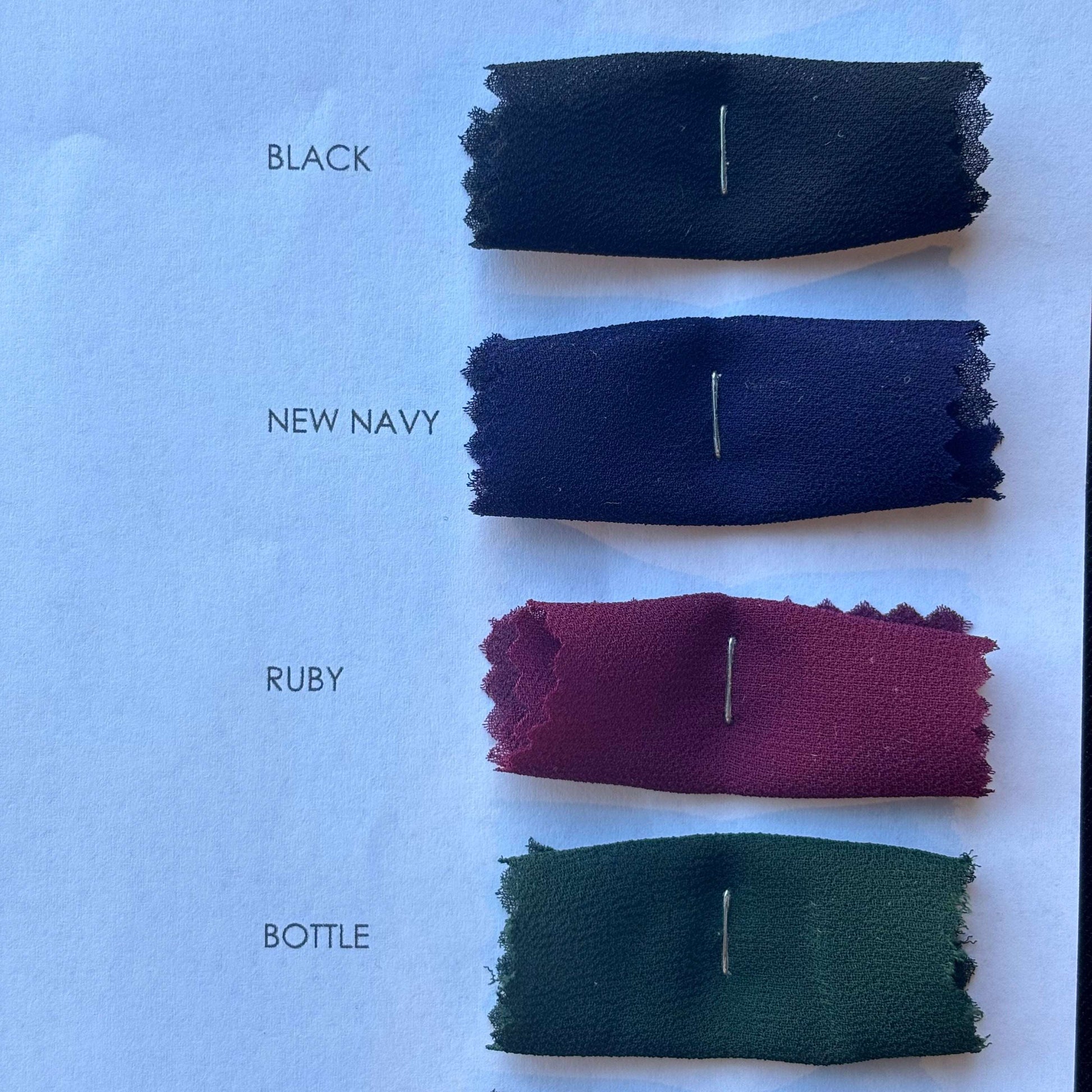 Presenting the black, new navy, ruby and bottle colors on the microgette color card