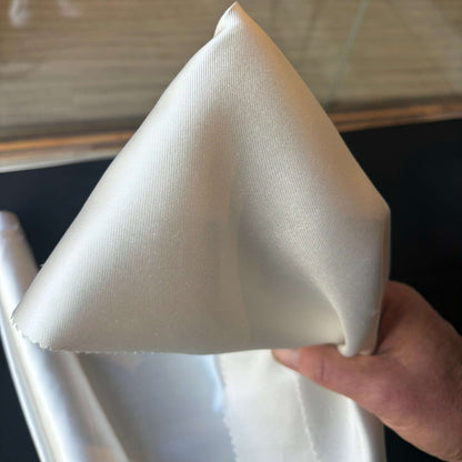 Showing Silk Mikado a pure mulberry silk with natural lustre held by hand