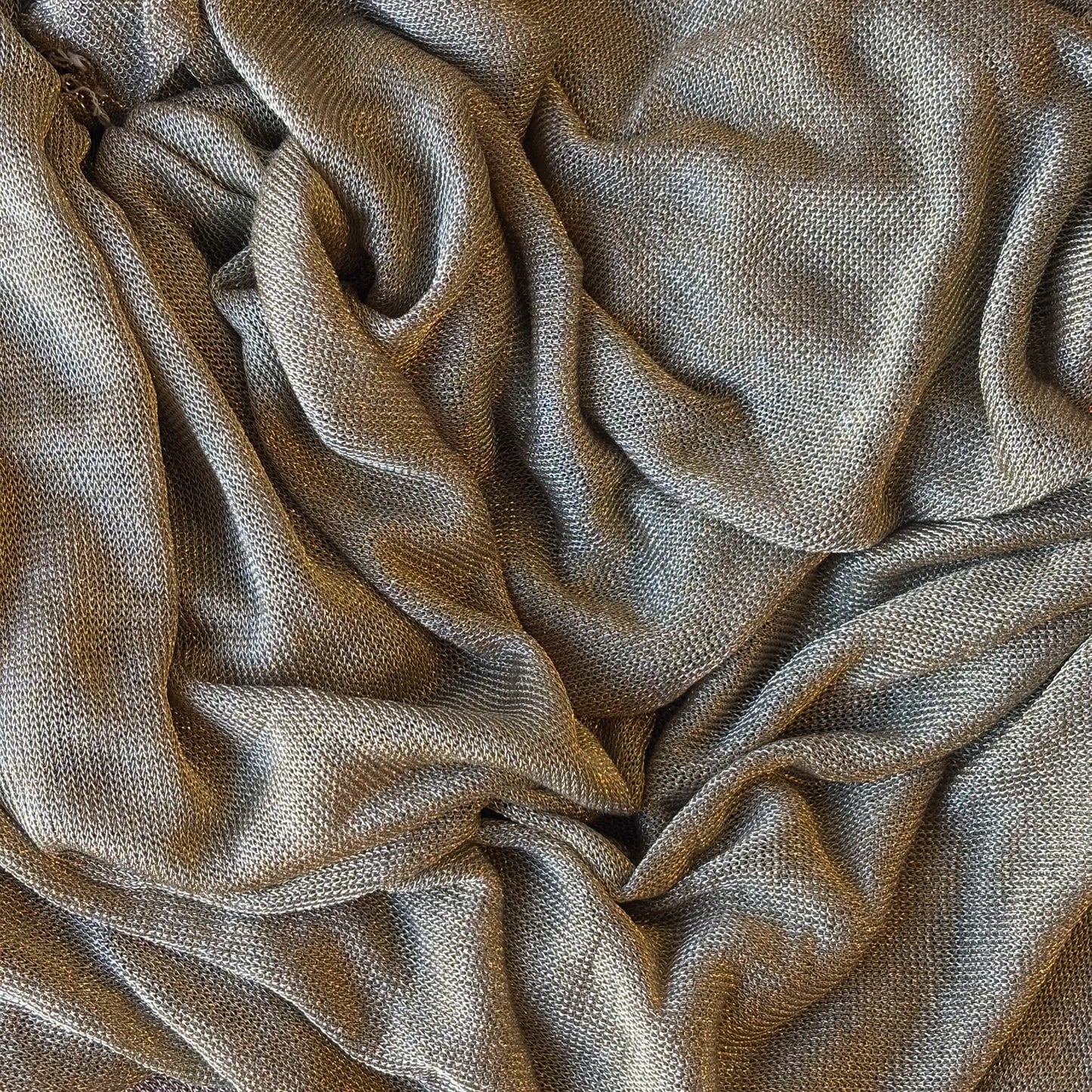 Exhibiting the gold version of Mithral a blended fabric  of metallic Rayon and lycra