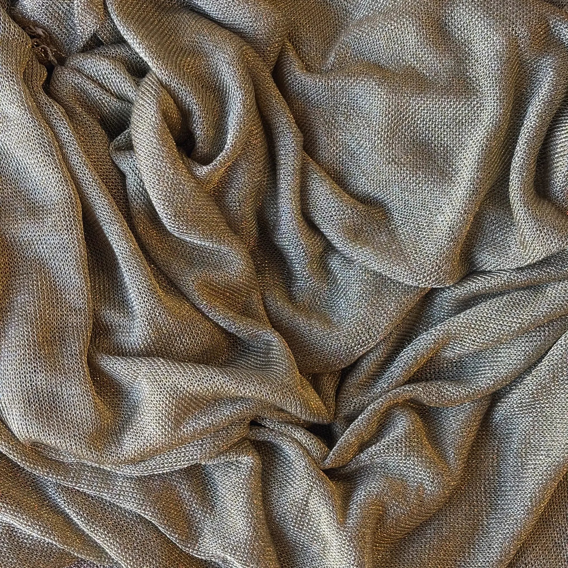 Exhibiting the gold version of Mithral a blended fabric  of metallic Rayon and lycra