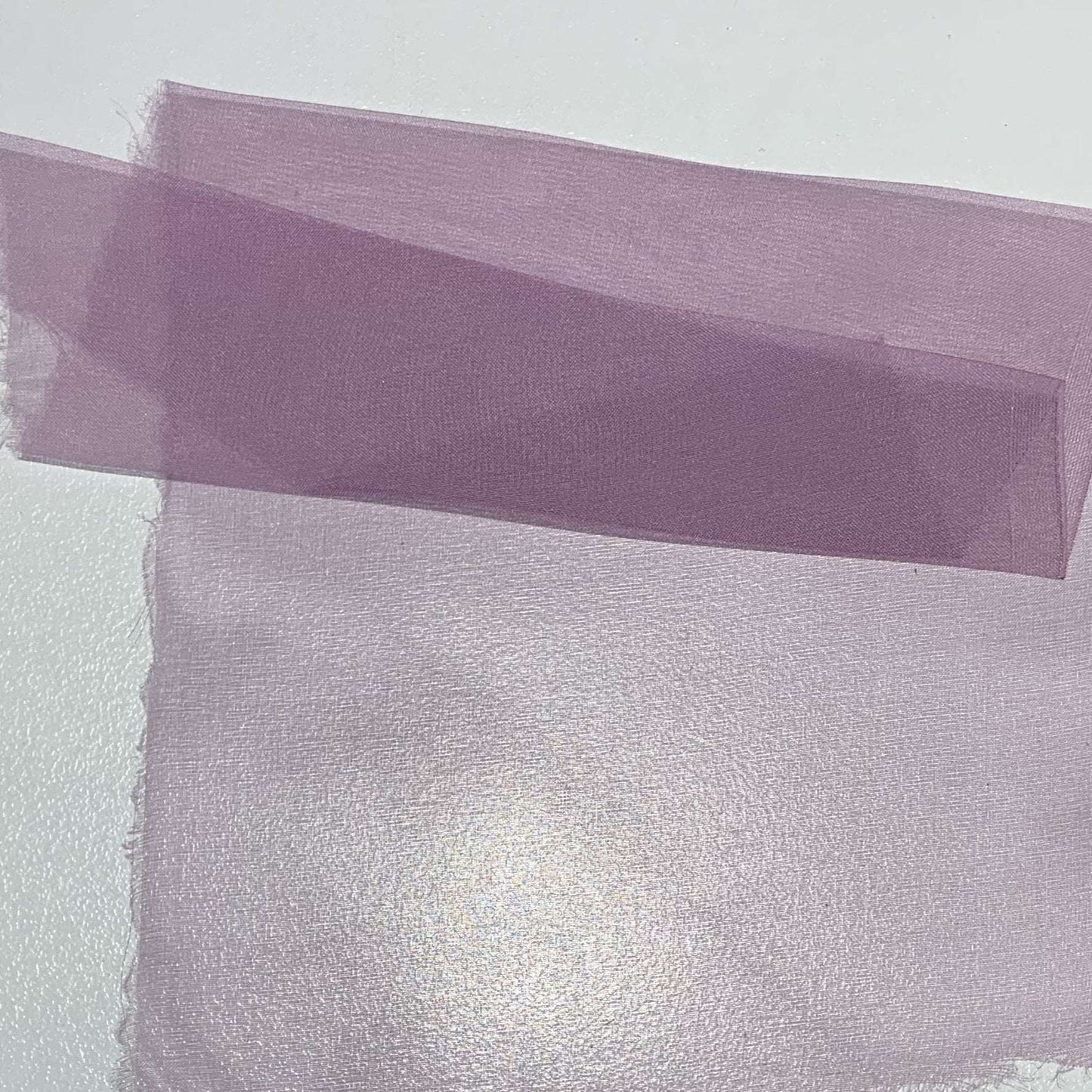 silk organza showing the lavender color version of a Lightweight stiff sheer pure silk with natural silk sheen