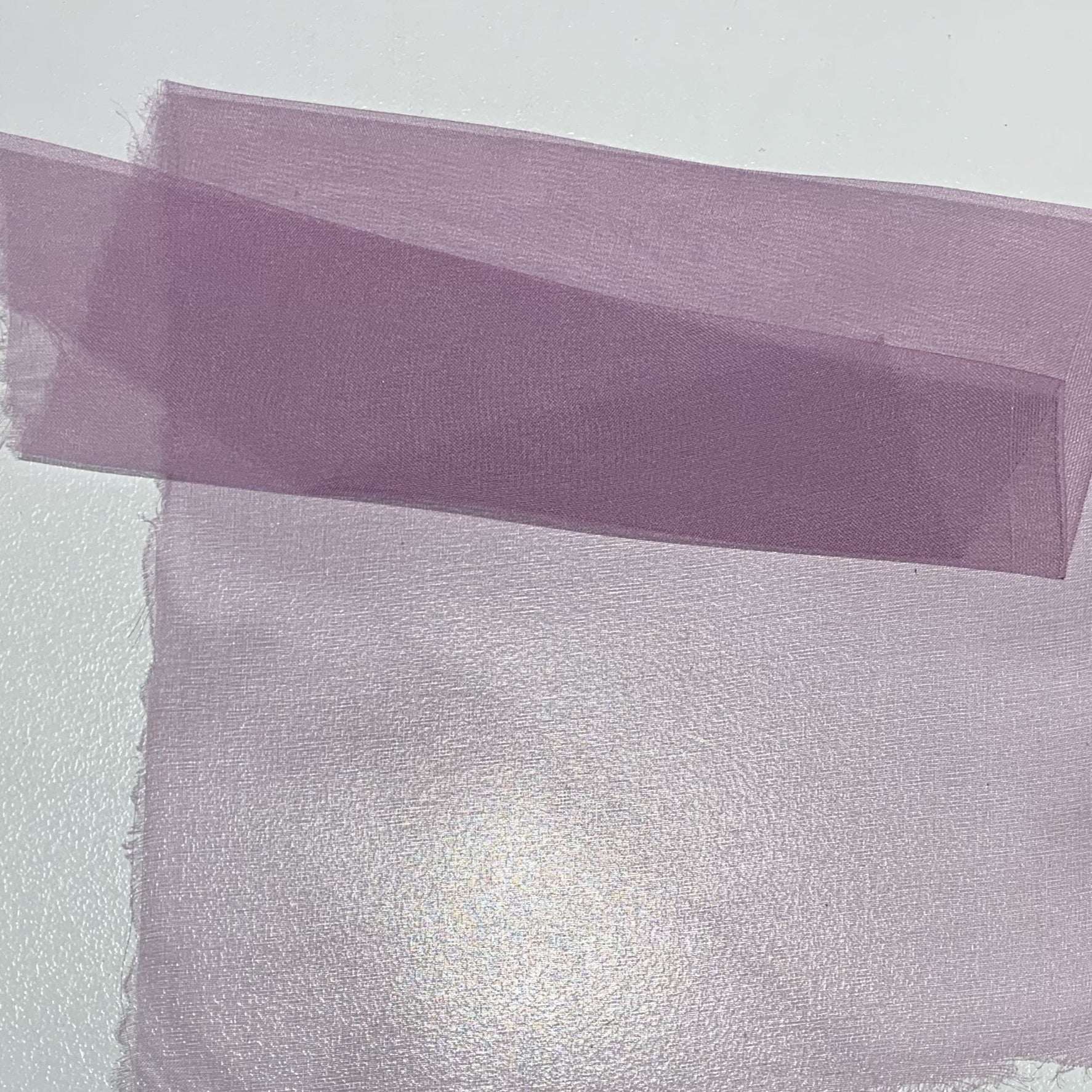 silk organza showing the lavender color version of a Lightweight stiff sheer pure silk with natural silk sheen