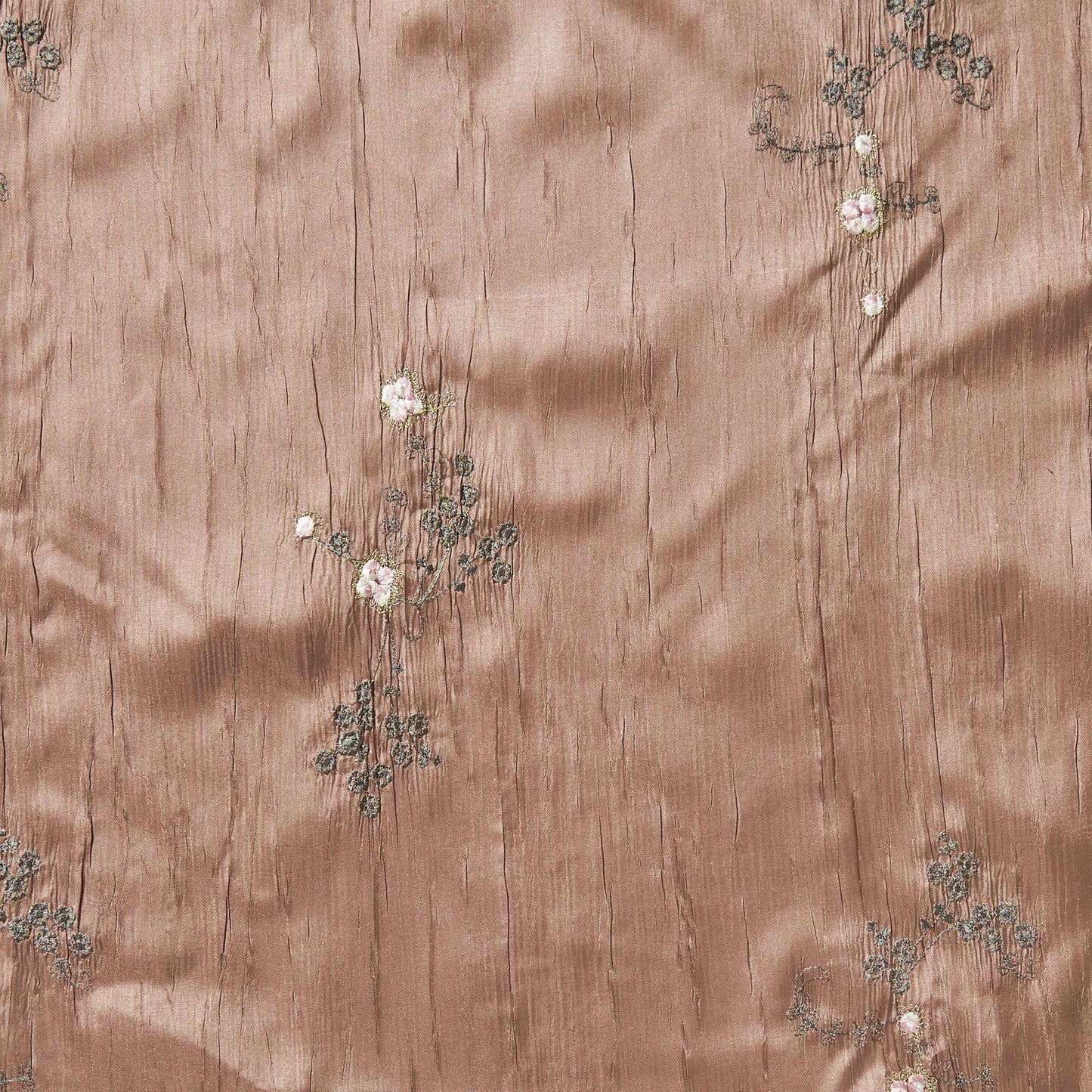 ruby showing the mink color version embroidered with simple floral pattern crisp pure polyester crushed taffeta