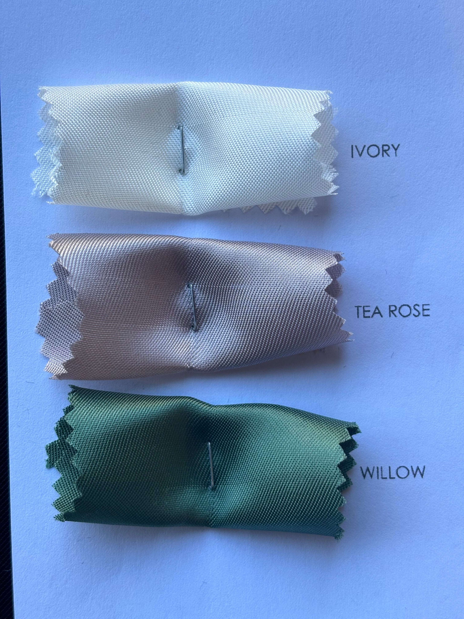Showing a closeup of the Saga color card swatches with uvory, tea rose and willow
