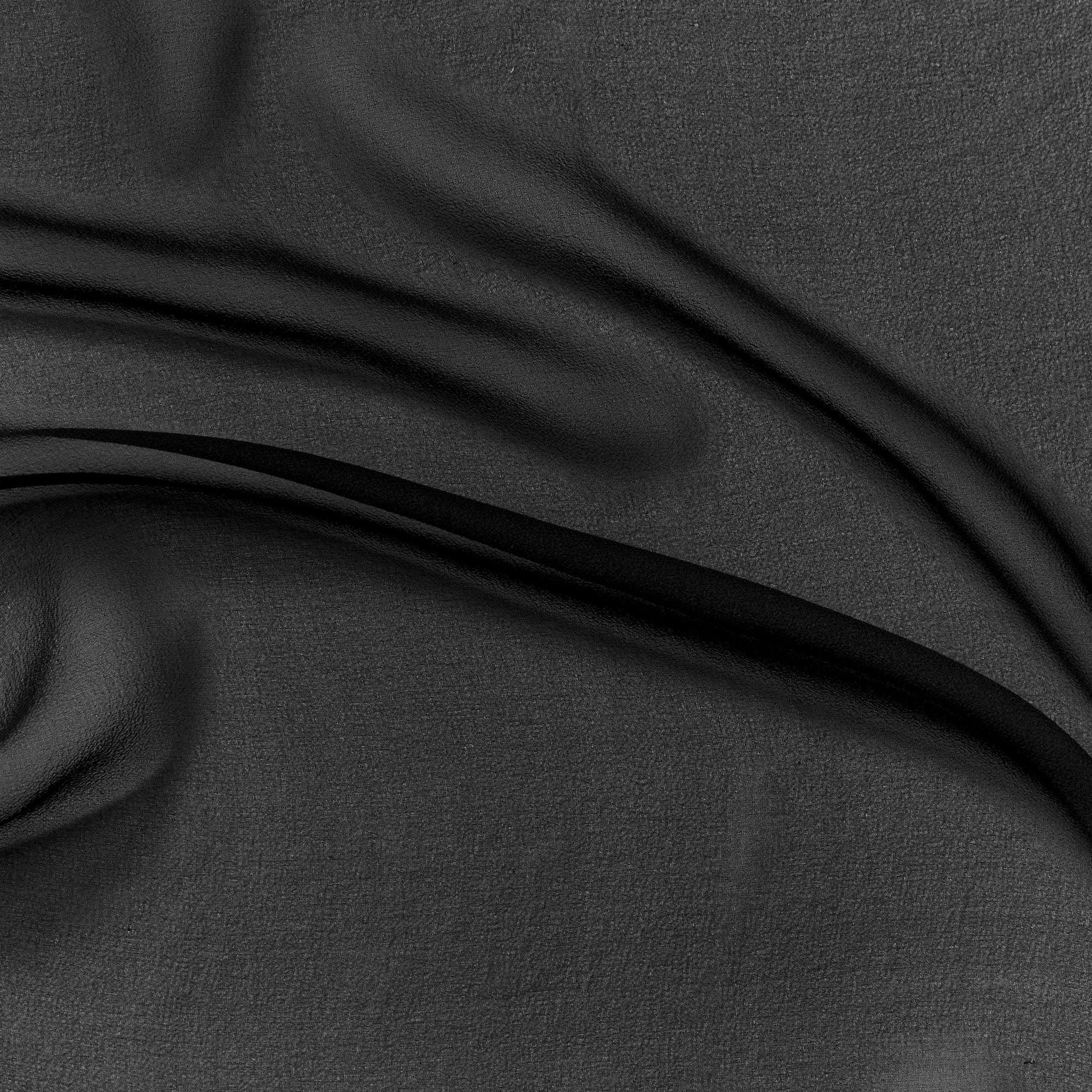 silk georgette showing the black color version of a Lightweight sheer floaty pure silk with excellent drape great for layering and gathering