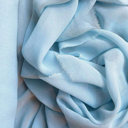 silk georgette showing the blue color version of a Lightweight sheer floaty pure silk with excellent drape great for layering and gathering