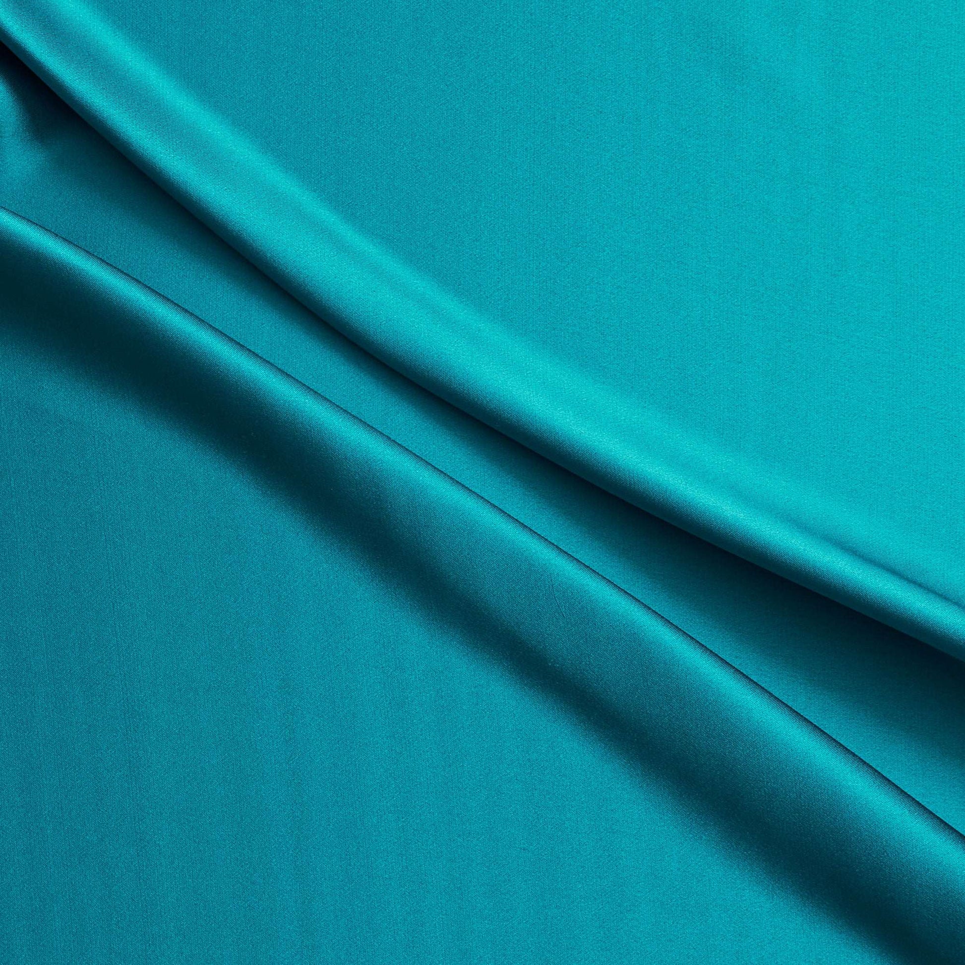 Silk Satin showing the Lagoon color version of a Soft Pure mulberry silk with natural sheen and fluid drape