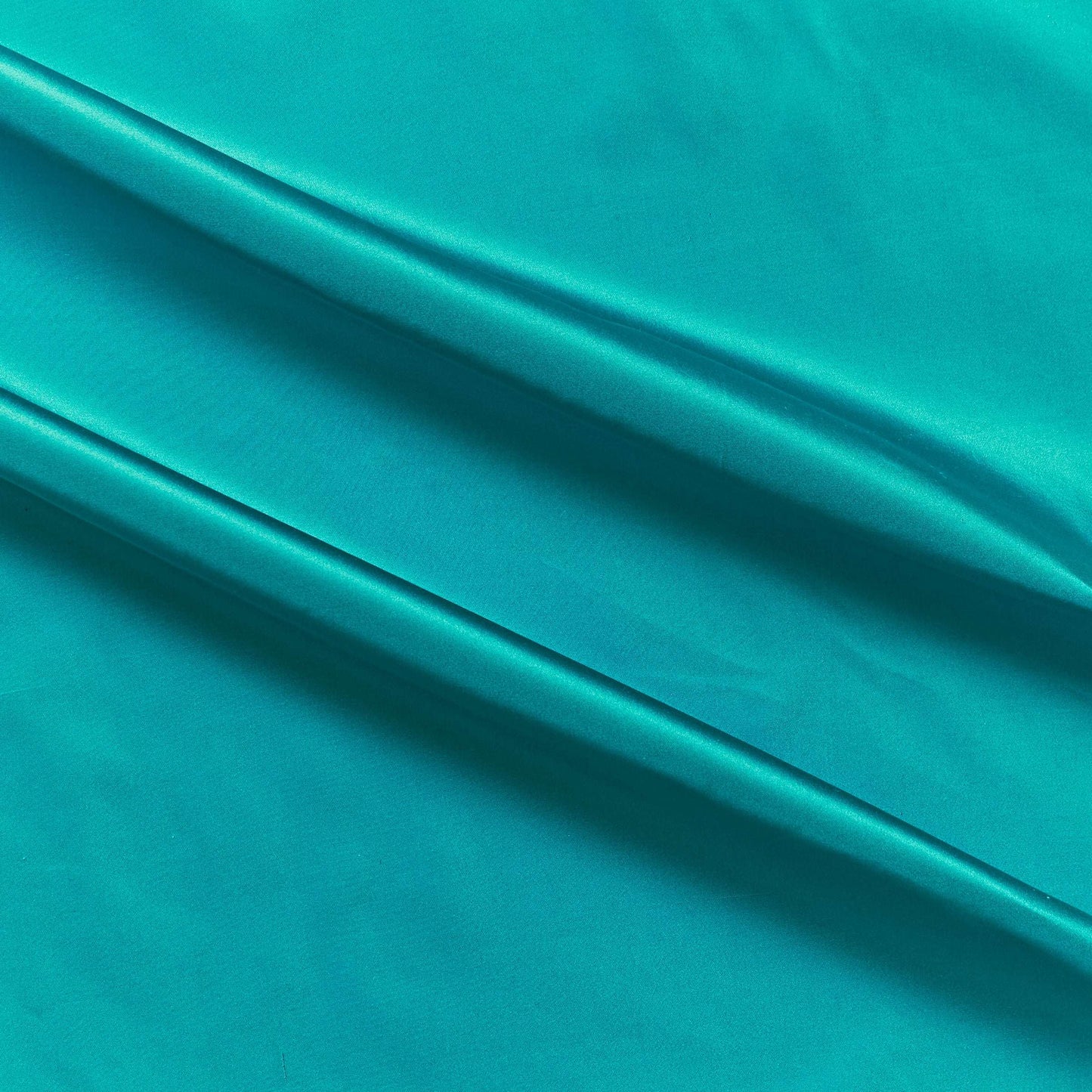 silk taffeta colours showing the turquoise color version of a smooth crisp pure silk with good drape