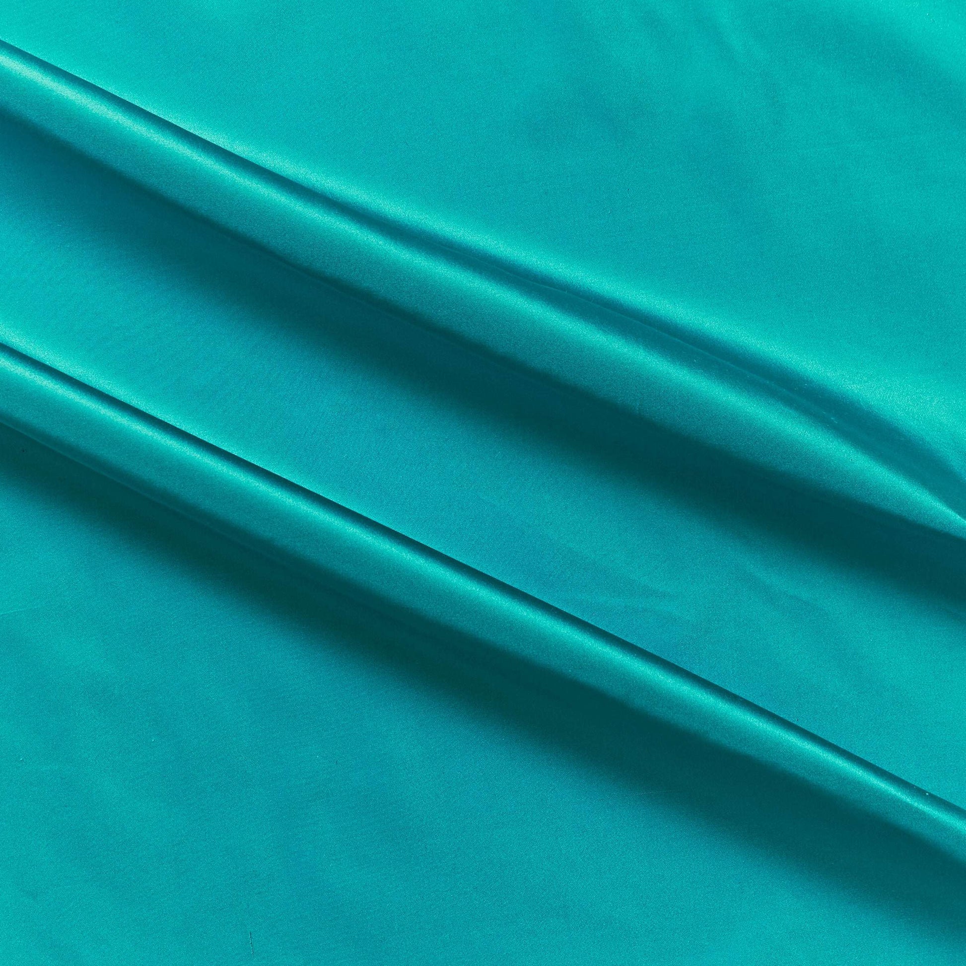 silk taffeta colours showing the turquoise color version of a smooth crisp pure silk with good drape