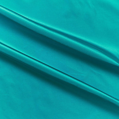 silk taffeta colours showing the turquoise color version of a smooth crisp pure silk with good drape
