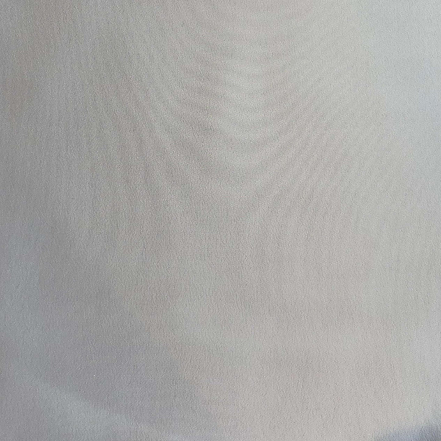 Showing Sylvie and silk and viscose like blended Crepe De Chine in a natural shade