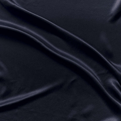supremo showing the navy color version of a soft sand washed delusterd pure silk with fluid drape