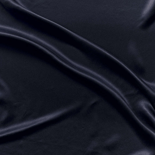 supremo showing the navy color version of a soft sand washed delusterd pure silk with fluid drape