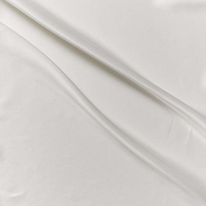 supremo showing the ivory color version of a sand washed soft delustered pure silk with fluid drape