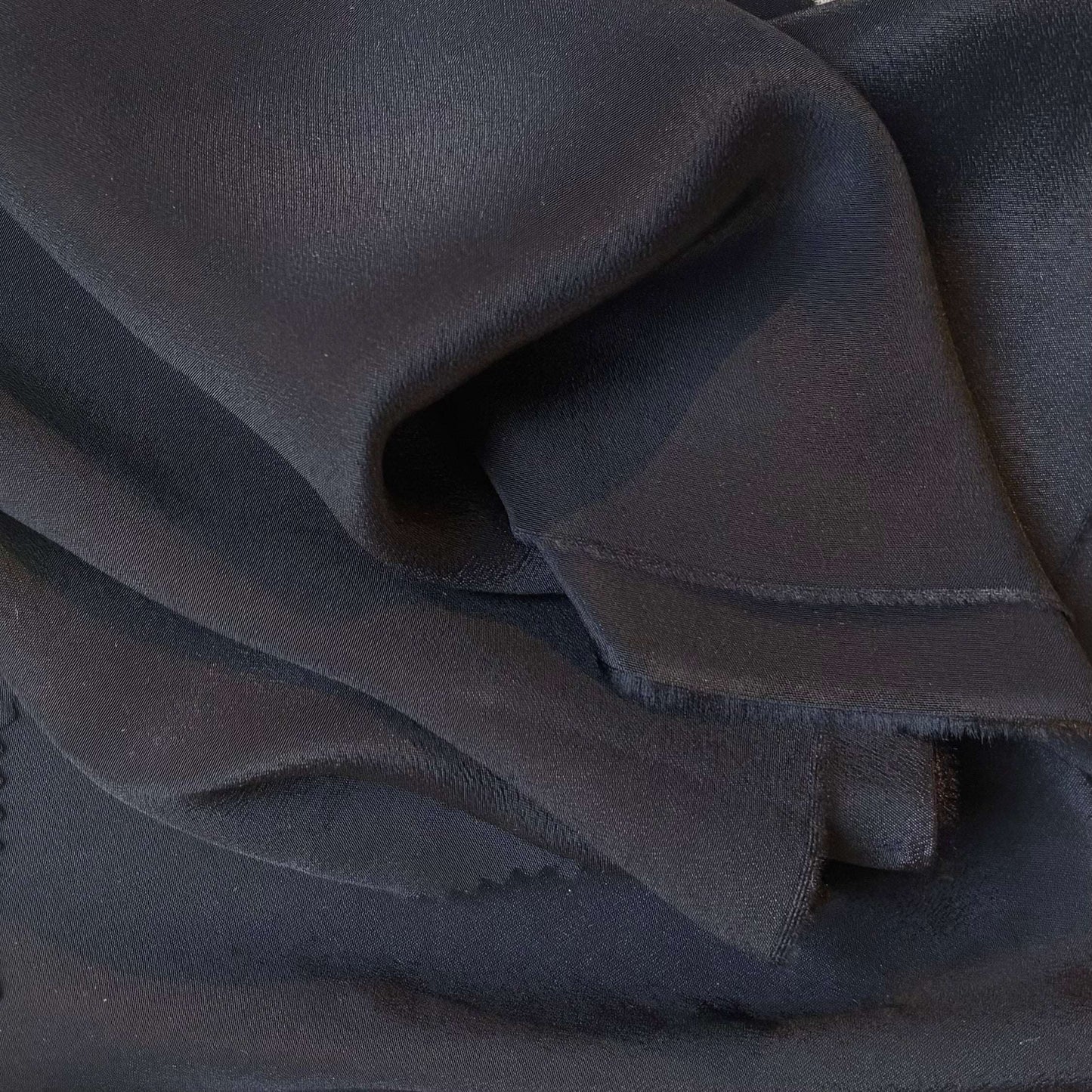 Displaying Sylvie and silk and viscose like blended Crepe De Chine in a black shade