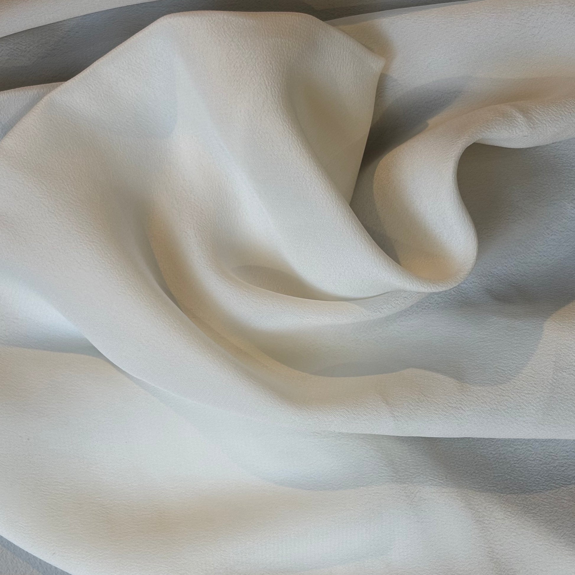 Exhibiting Sylvie and silk and viscose like blended Crepe De Chine in a natural shade