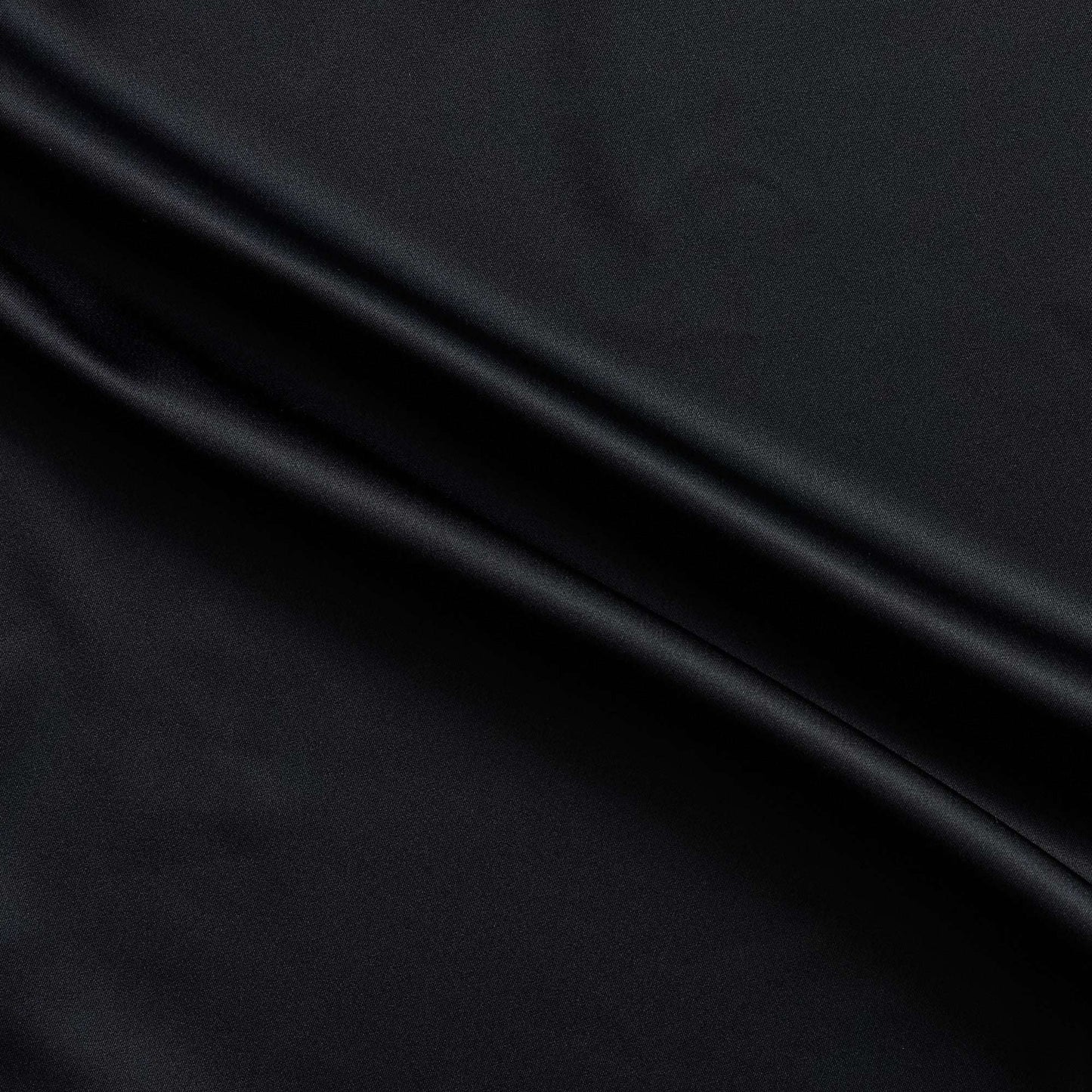 Trump showing the black color version of a stretch duchess satin polyester and lycra blend with a delustered smooth sateen finish and gutsy weight