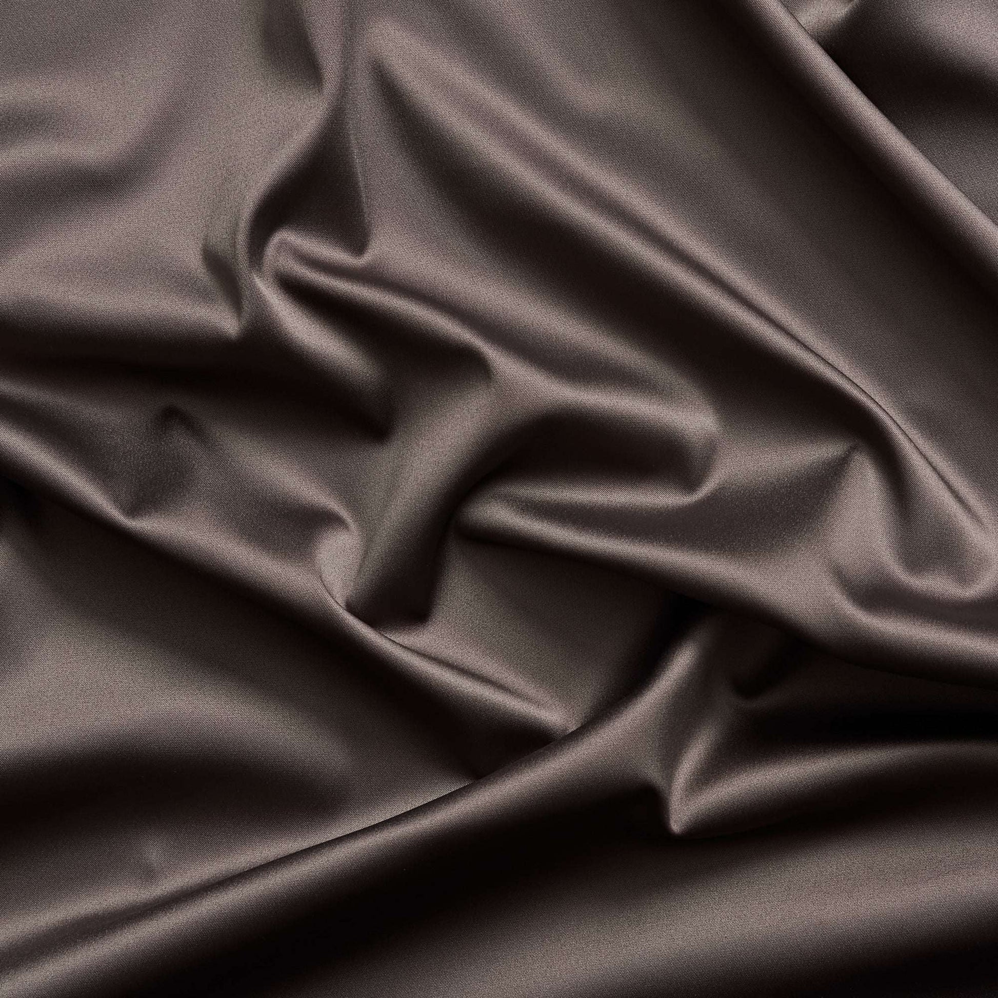Trump showing the coffee color version of a stretch duchess satin polyester and lycra blend with a delustered smooth sateen finish and gutsy weight