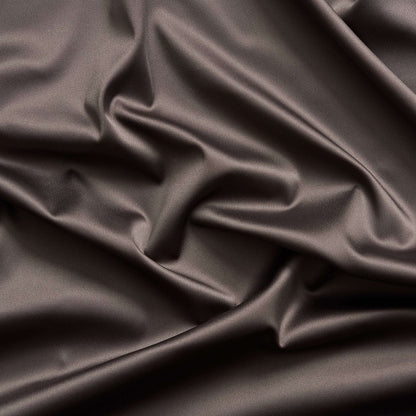 Trump showing the coffee color version of a stretch duchess satin polyester and lycra blend with a delustered smooth sateen finish and gutsy weight