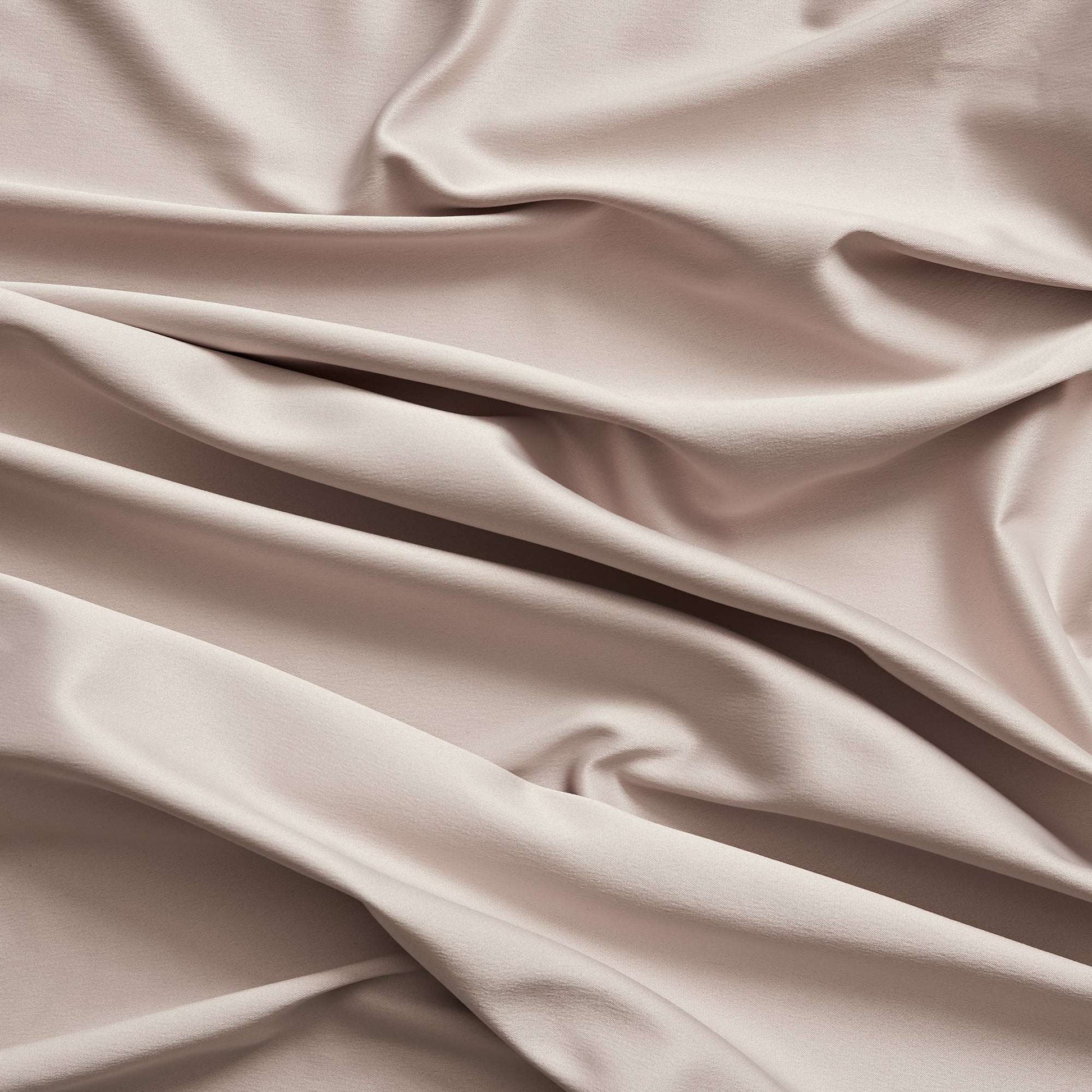 Trump showing the Diamond color version of a stretch duchess satin polyester and lycra blend with a delustered smooth sateen finish and gutsy weight