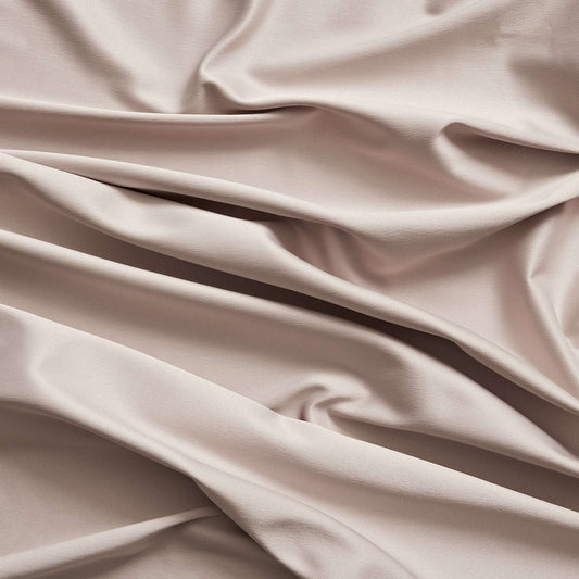 Trump showing the Diamond color version of a stretch duchess satin polyester and lycra blend with a delustered smooth sateen finish and gutsy weight
