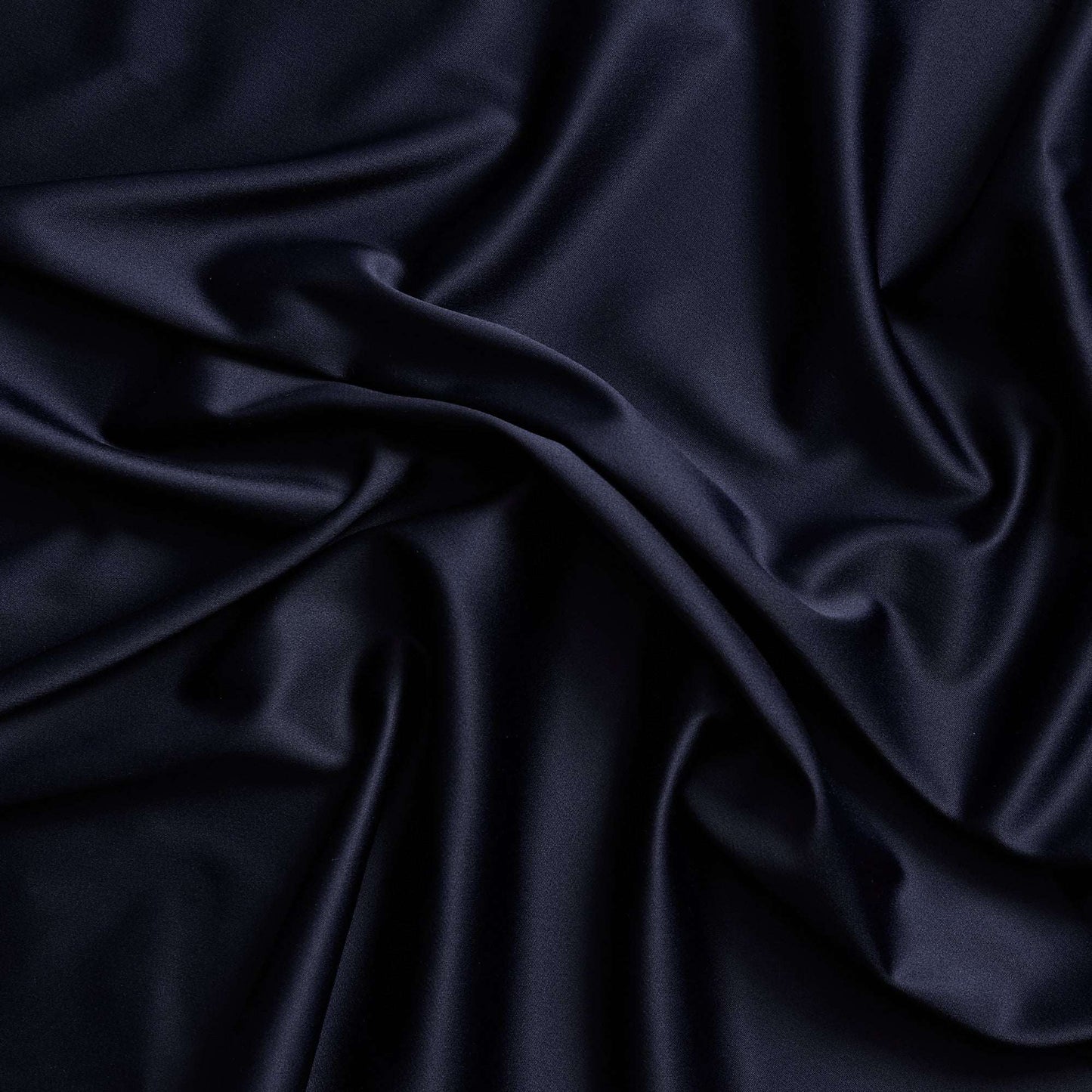 Trump showing the ink color version of a stretch duchess satin polyester and lycra blend with a delustered smooth sateen finish and gutsy weight