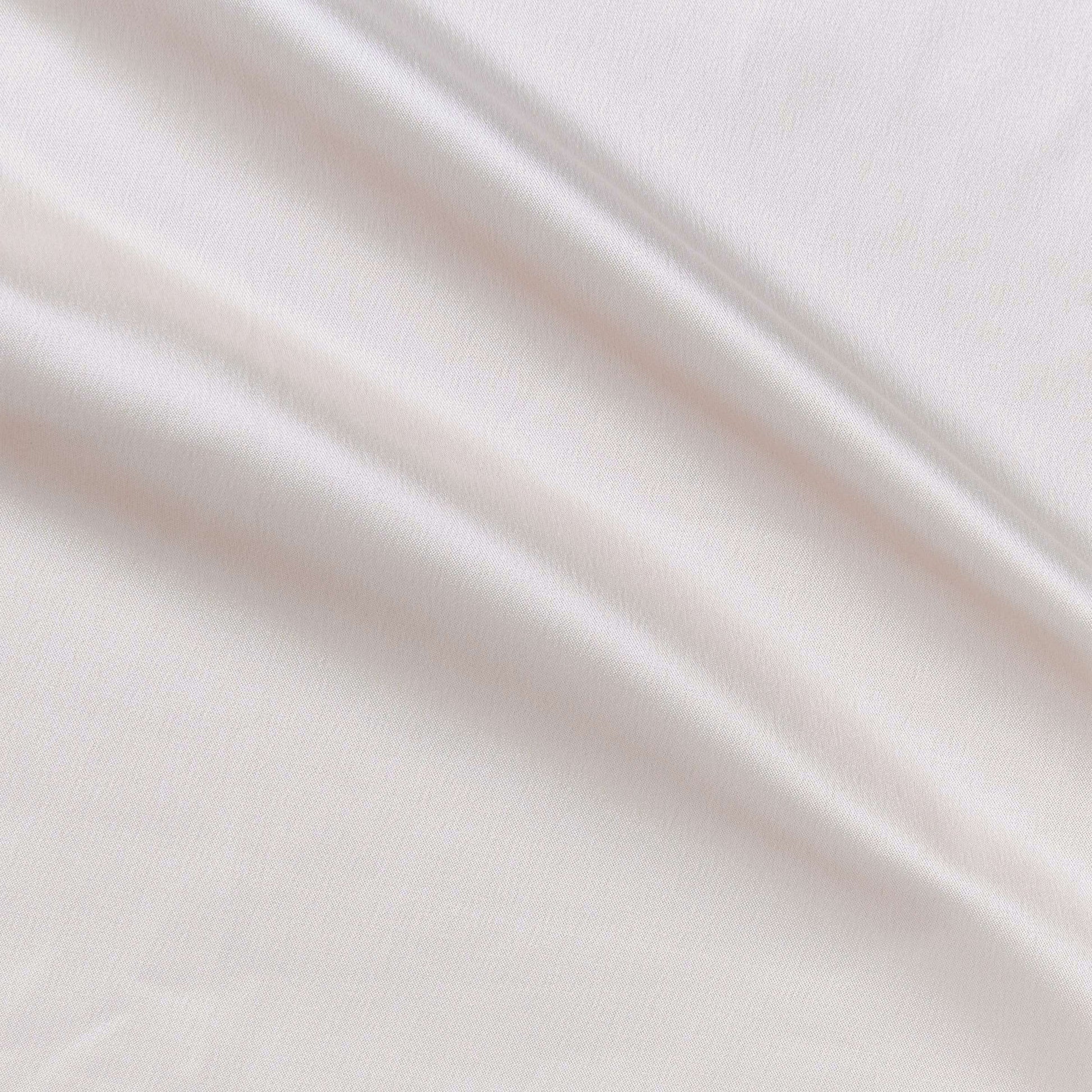 Trump showing the Ivory color version of a stretch duchess satin polyester and lycra blend with a delustered smooth sateen finish and gutsy weight