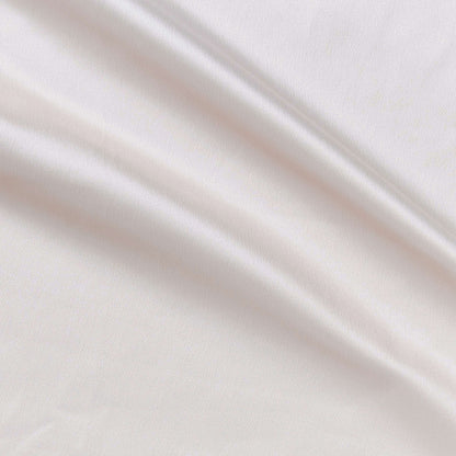 Trump showing the Ivory color version of a stretch duchess satin polyester and lycra blend with a delustered smooth sateen finish and gutsy weight