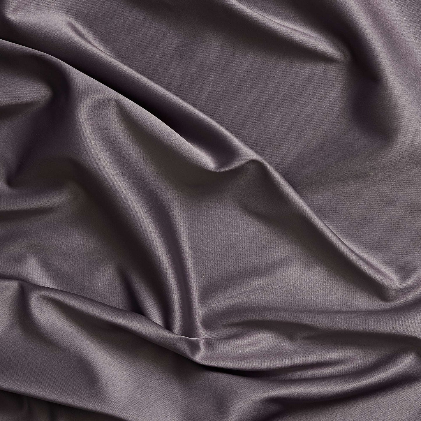 Trump showing the slate color version of a stretch duchess satin polyester and lycra blend with a delustered smooth sateen finish and gutsy weight