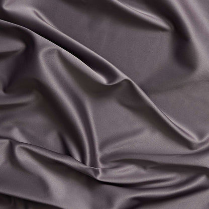 Trump showing the slate color version of a stretch duchess satin polyester and lycra blend with a delustered smooth sateen finish and gutsy weight