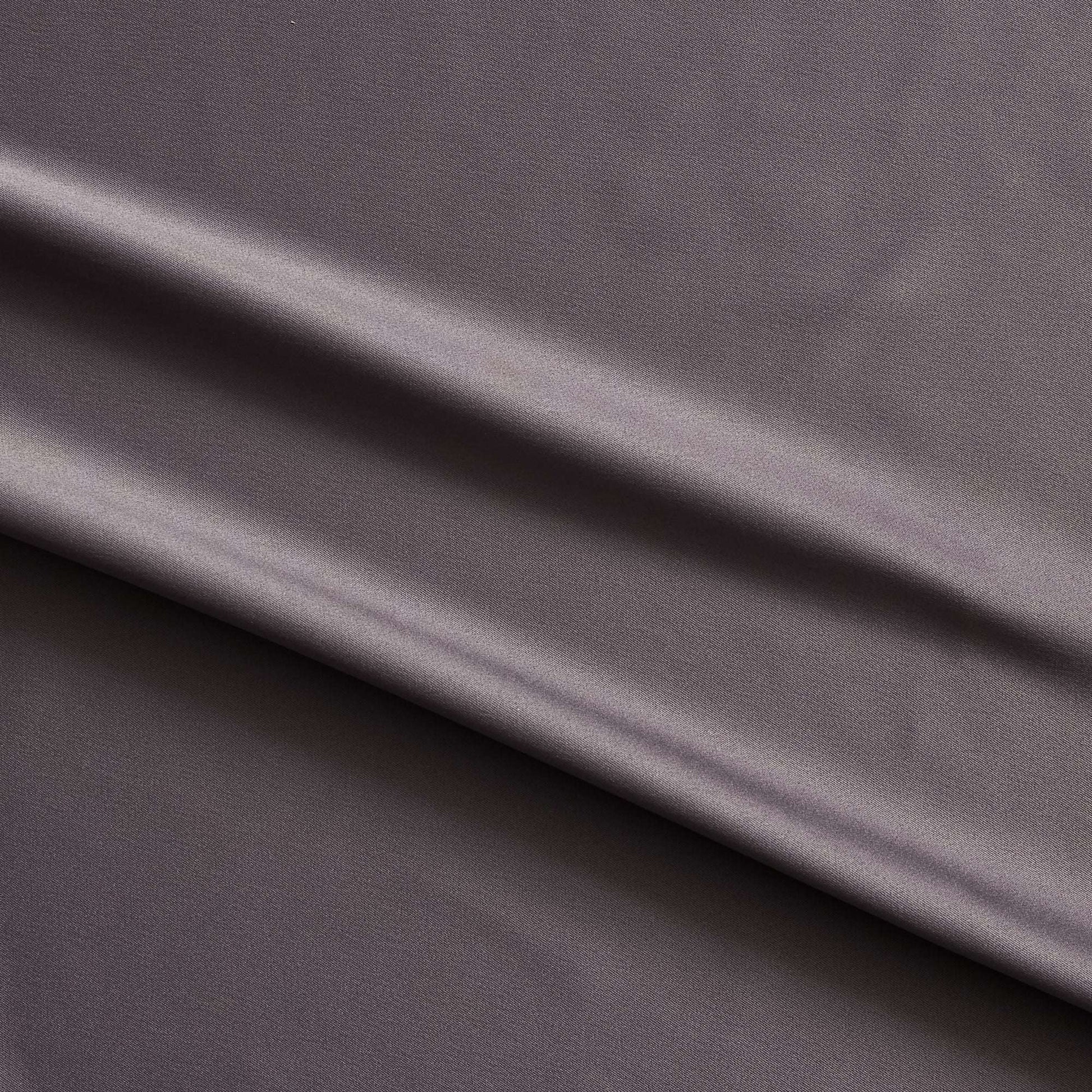 Trump showing the slate color version of a stretch duchess satin polyester and lycra blend with a delustered smooth sateen finish and gutsy weight