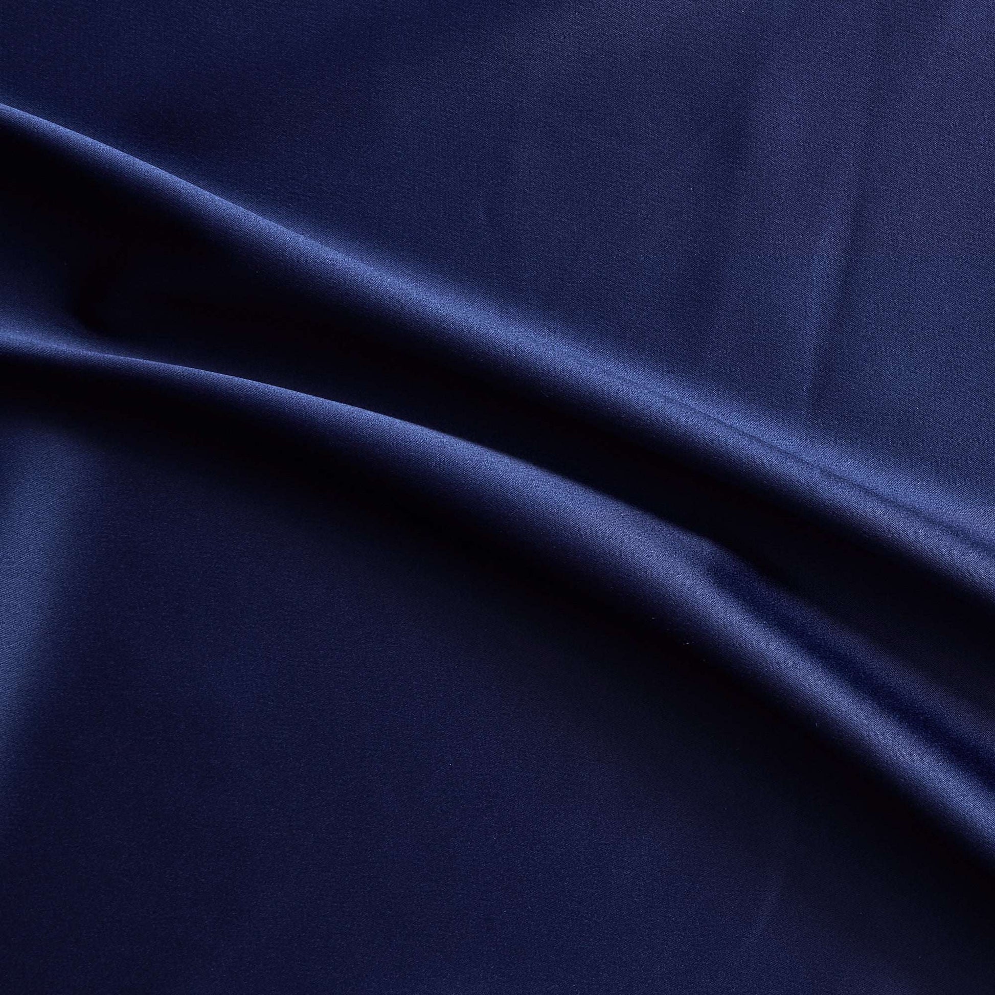 Trump showing the midnight color version of a stretch duchess satin polyester and lycra blend with a delustered smooth sateen finish and gutsy weight