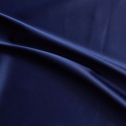 Trump showing the midnight color version of a stretch duchess satin polyester and lycra blend with a delustered smooth sateen finish and gutsy weight