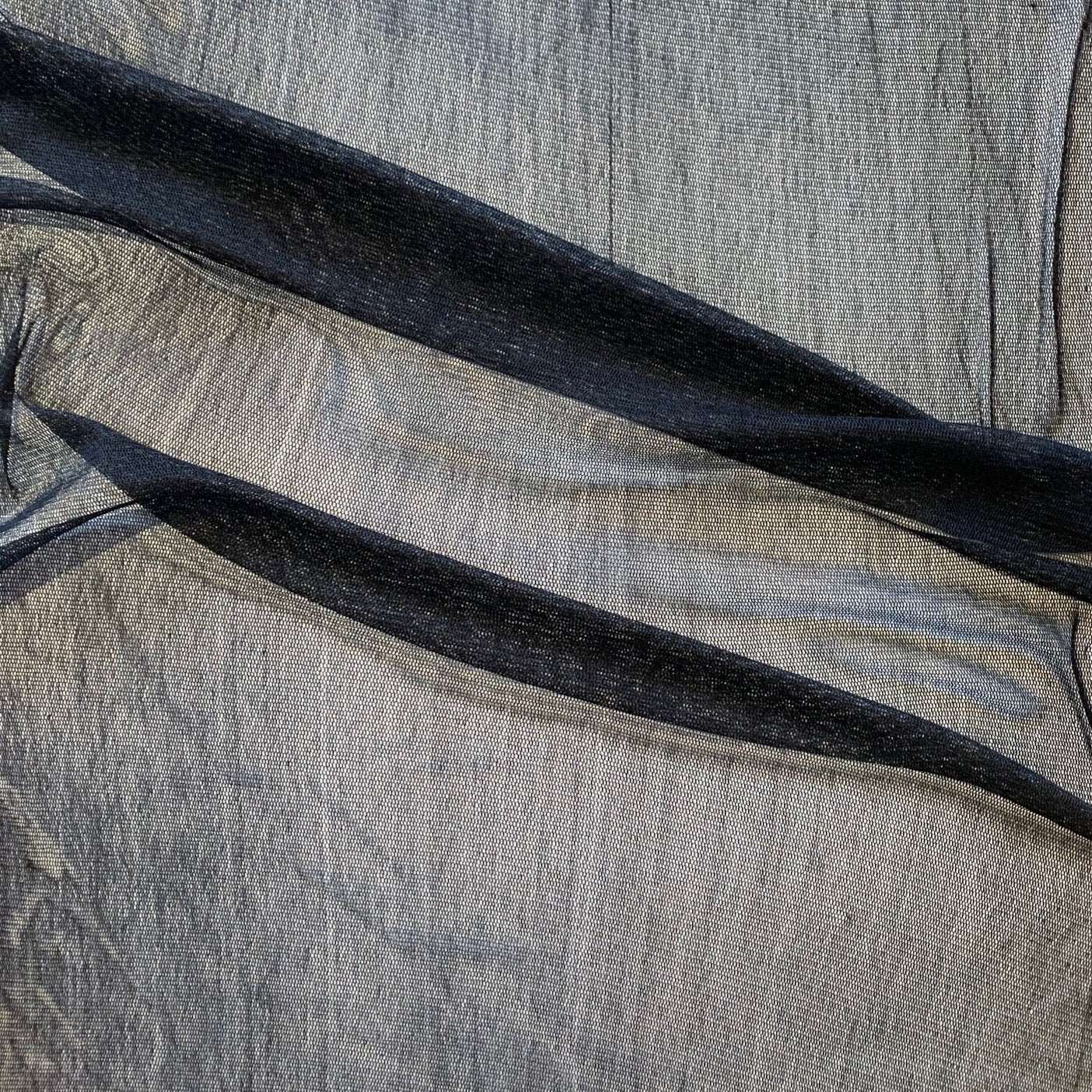 vapour showing the black color variant of a soft sheer breathable light weight matte pure silk tulle featuring natural silk sheen