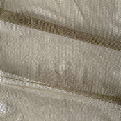 vapour showing the ecru color variant of a soft sheer breathable light weight matte pure silk tulle  with natural silk sheen