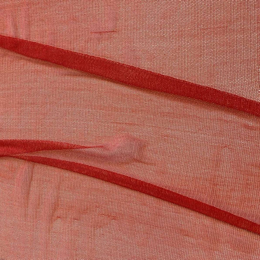 vapour showing the vermillion color variant of a soft sheer breathable light weight matte pure silk tulle with natural silk sheen