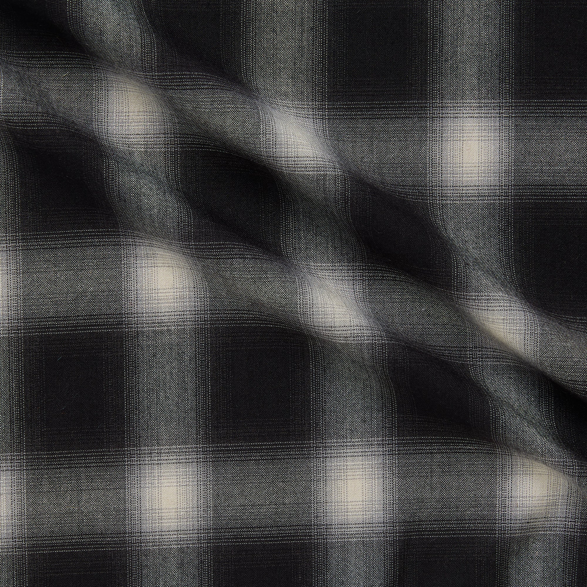 Displaying Blur which features black shaded colors on soft checks on a stretch polyester and rayon with spandex for stretch