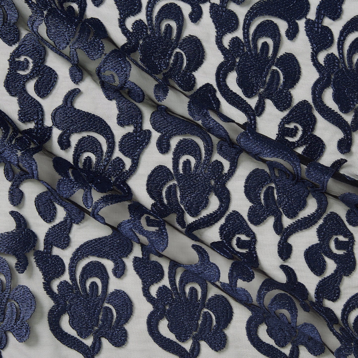 brooklyn showing the navy color version floral embroidery on rayon and polyester mesh base