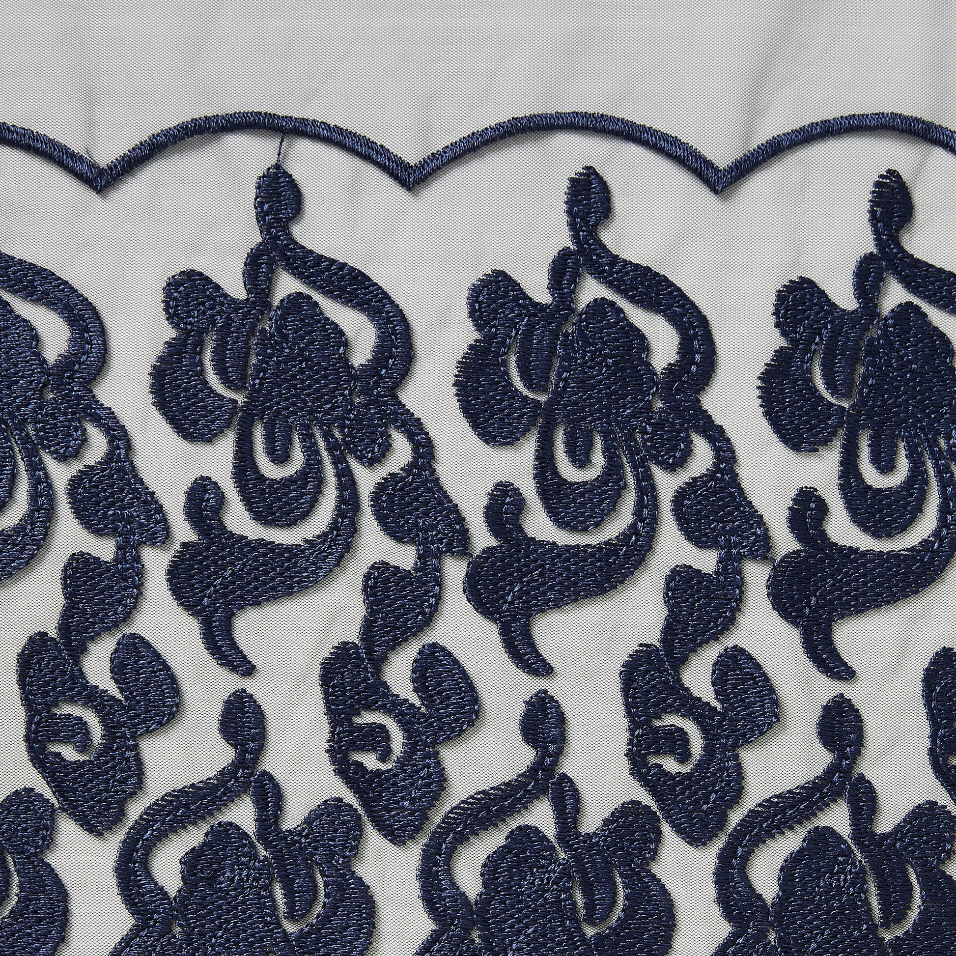 brooklyn showing the navy color version floral embroidery on rayon and polyester mesh base scalloped