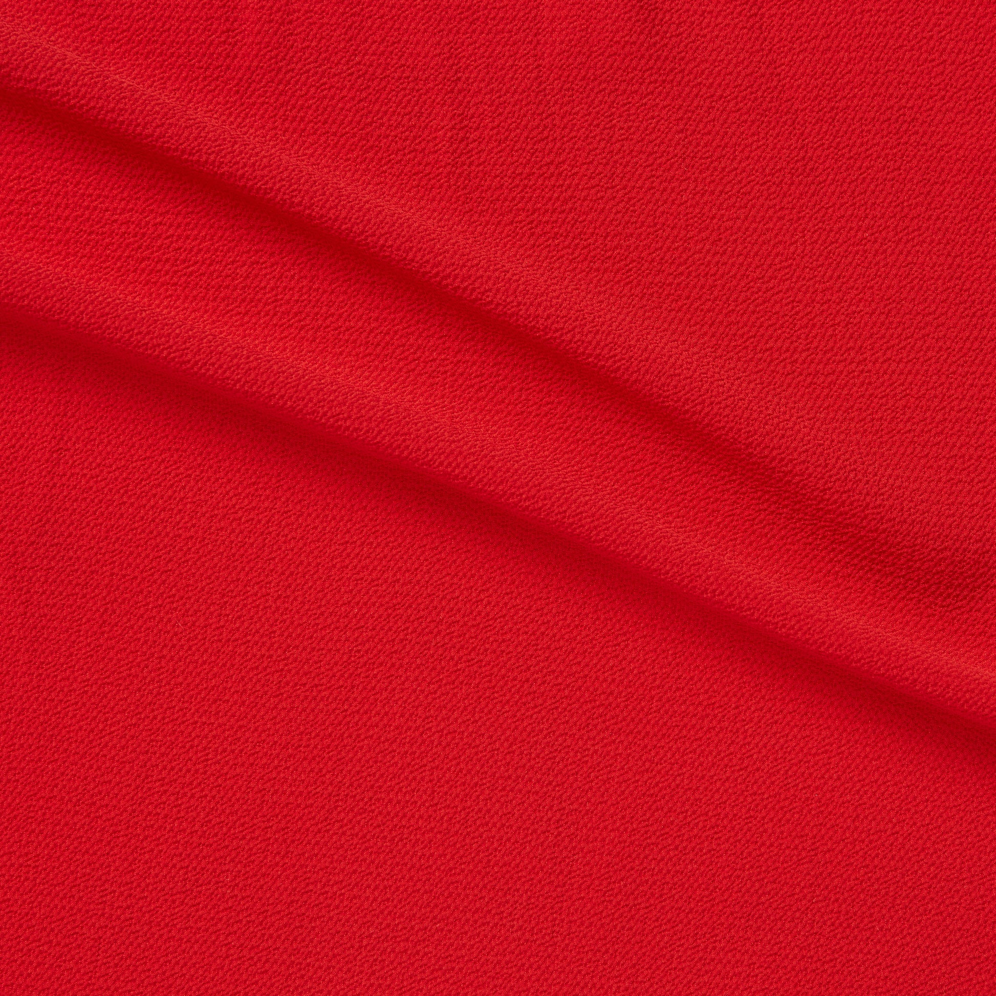 bubble displaying the chilli color version featuring soft light weight stretch crepe-weave polyester with spandex featuring great drape