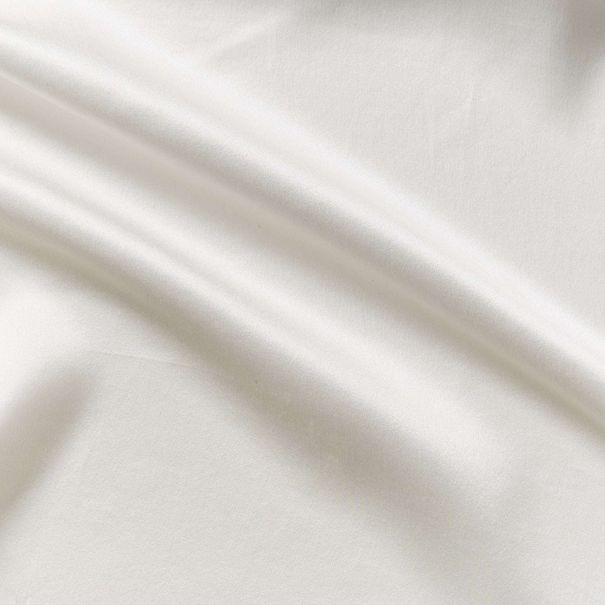 charmeuse Illustrating the natural color version of a pure light weight silk with satin lustre and fluid drape featuring a wide width