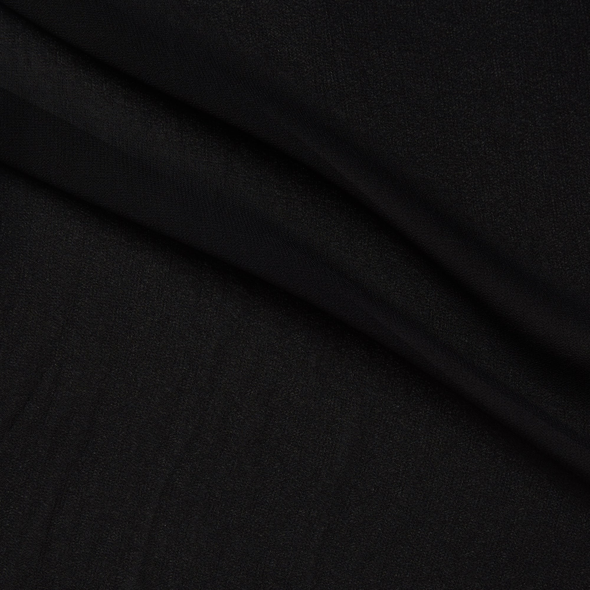 Presenting Chelsea a black colored double georgette pure viscose fabric with crinkled face and fluid drape