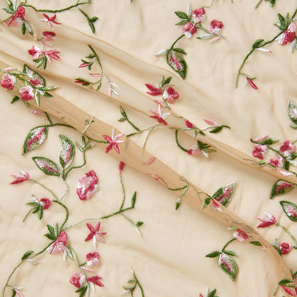 cherish displaying the beige base color version featuring a nylon delicate floral vine embroidery on nude rayon mesh