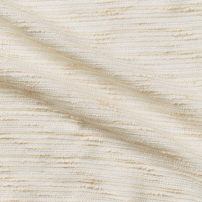 coco showing the cream color version of a polyester cotton blend bouclé fabric with lurex thread 