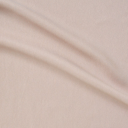 columbia displaying the nude color version of a textured face rayon and acetate blend with good drape